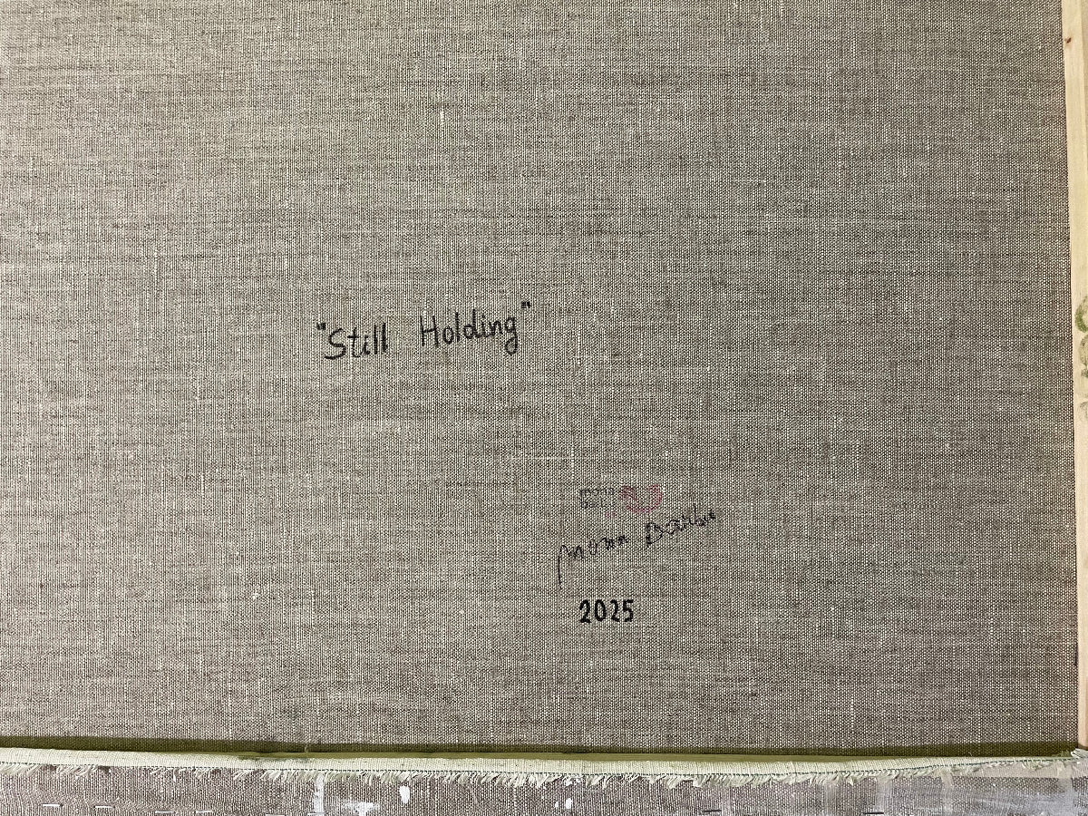 signature of artist on the back of artwork